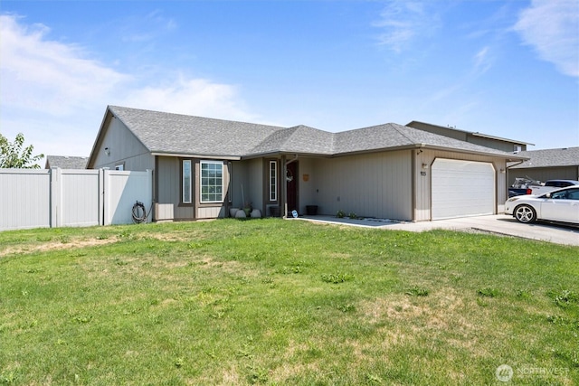 925 S 11th Ave, Othello, WA 99344 - ranch-style home with a garage, concrete driveway, and a shingled roof