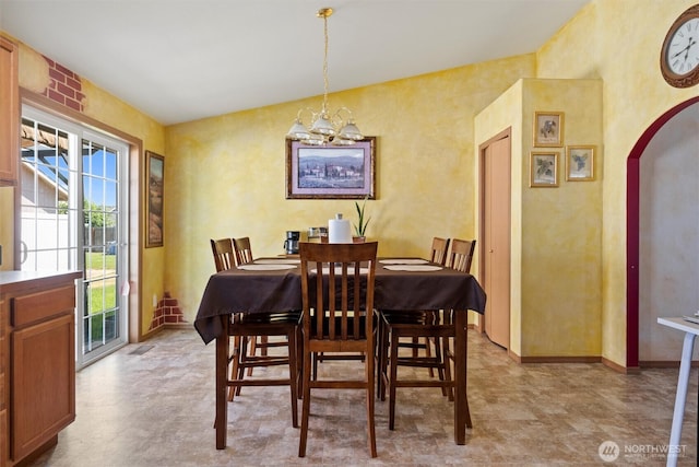 925 S 11th Ave, Othello, WA 99344 - dining space featuring a chandelier and arched walkways