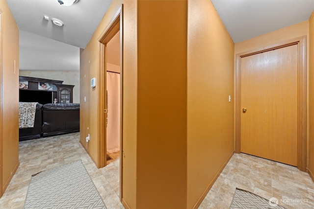 925 S 11th Ave, Othello, WA 99344 - corridor with stone finish floors and lofted ceiling