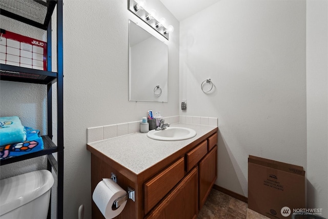 925 S 11th Ave, Othello, WA 99344 - bathroom featuring vanity and toilet