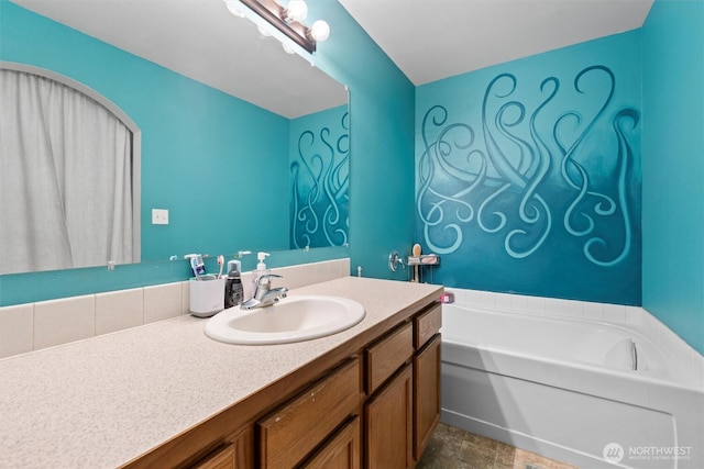925 S 11th Ave, Othello, WA 99344 - bathroom with a garden tub, vanity, and stone finish floors