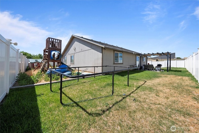 925 S 11th Ave, Othello, WA 99344 - rear view of house featuring a playground, a fenced backyard, and a pergola