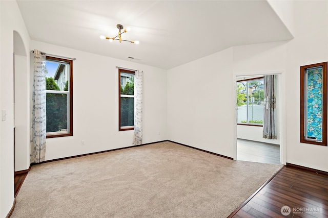 22820 41st Dr SE, Bothell, WA 98021 - unfurnished room with healthy amount of natural light, a chandelier, and wood finished floors