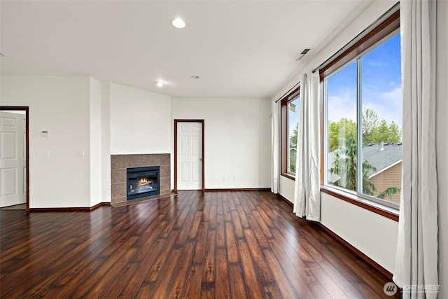 22820 41st Dr SE, Bothell, WA 98021 - unfurnished living room featuring wood finished floors, healthy amount of natural light, recessed lighting, and a tile fireplace