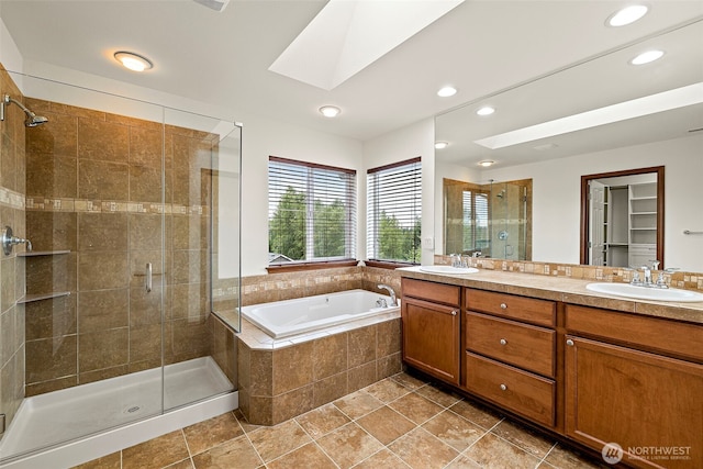 22820 41st Dr SE, Bothell, WA 98021 - full bathroom with a skylight, a stall shower, double vanity, a bath, and recessed lighting