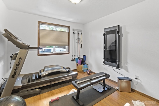 10208 D St E, Tacoma, WA 98445 - exercise area featuring wood finished floors and baseboards