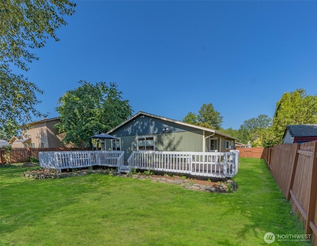 10208 D St E, Tacoma, WA 98445 - rear view of house featuring a fenced backyard and a wooden deck