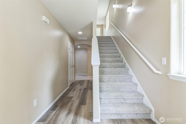 323 Helen St, Sedro Woolley, WA 98284 - staircase featuring wood finished floors, arched walkways, and recessed lighting