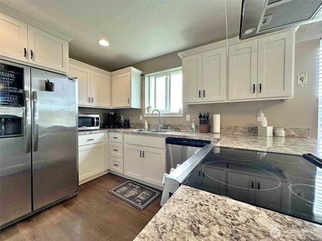 704 Roundtree Blvd, Winlock, WA 98596 - kitchen featuring appliances with stainless steel finishes, dark wood-style flooring, recessed lighting, and white cabinets