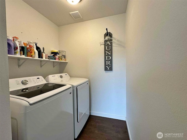 704 Roundtree Blvd, Winlock, WA 98596 - washroom featuring washer and clothes dryer and dark wood finished floors