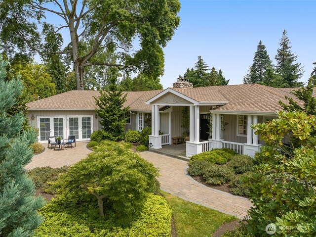 3204 Evergreen Point Rd, Medina, WA 98039 - ranch-style home featuring covered porch, a chimney, and roof with shingles