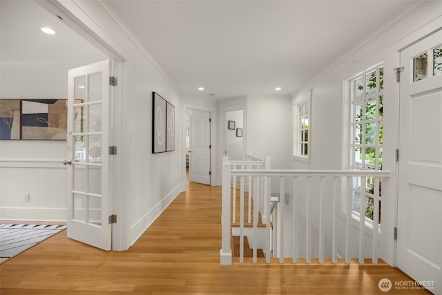 3204 Evergreen Point Rd, Medina, WA 98039 - corridor featuring ornamental molding, light wood-type flooring, an upstairs landing, and recessed lighting