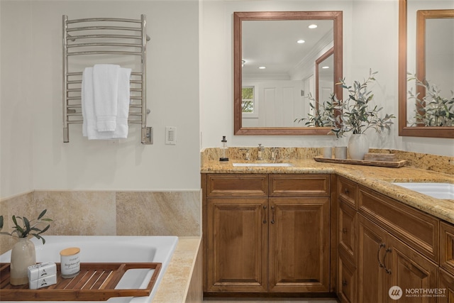 3204 Evergreen Point Rd, Medina, WA 98039 - bathroom featuring radiator heating unit, double vanity, a tub to relax in, a towel warming rack, and recessed lighting