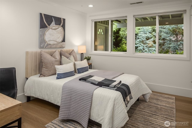 3204 Evergreen Point Rd, Medina, WA 98039 - bedroom with crown molding, wood finished floors, and recessed lighting