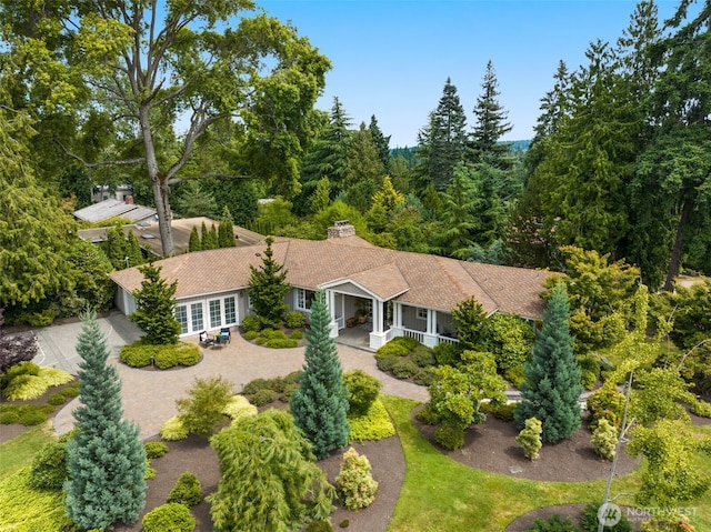 3204 Evergreen Point Rd, Medina, WA 98039 - view of front of house featuring decorative driveway, a chimney, and covered porch