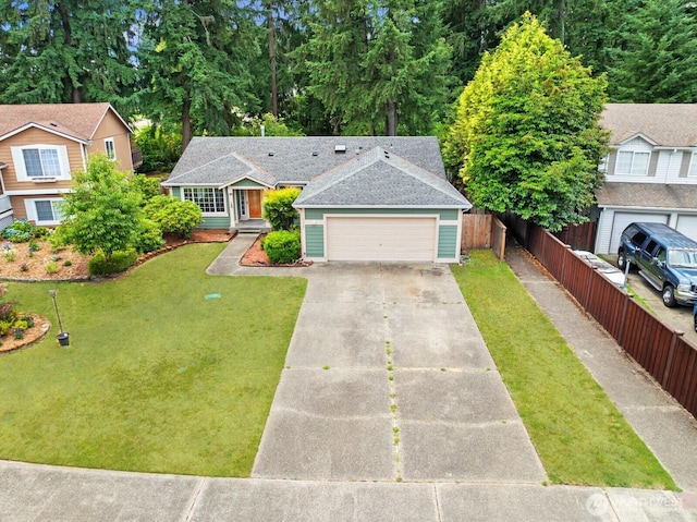 4327 Cedar Ct SE, Lacey, WA 98503 - view of front facade with concrete driveway, a garage, and a shingled roof