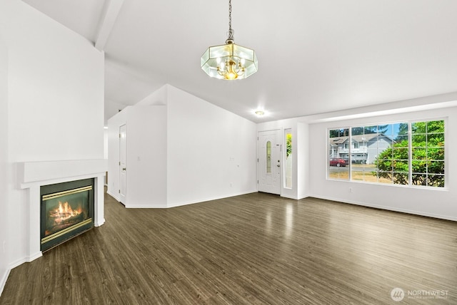 4327 Cedar Ct SE, Lacey, WA 98503 - unfurnished living room featuring dark wood-type flooring, a chandelier, a glass covered fireplace, and lofted ceiling