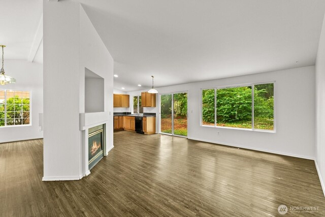 4327 Cedar Ct SE, Lacey, WA 98503 - unfurnished living room featuring dark wood finished floors, healthy amount of natural light, recessed lighting, and a glass covered fireplace