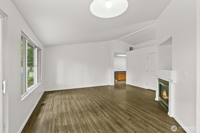 4327 Cedar Ct SE, Lacey, WA 98503 - unfurnished living room with vaulted ceiling, dark wood-style floors, and a glass covered fireplace