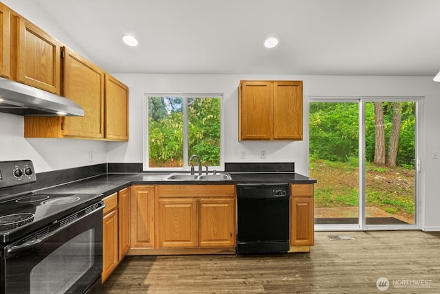 4327 Cedar Ct SE, Lacey, WA 98503 - kitchen with black appliances, dark wood finished floors, under cabinet range hood, dark countertops, and recessed lighting