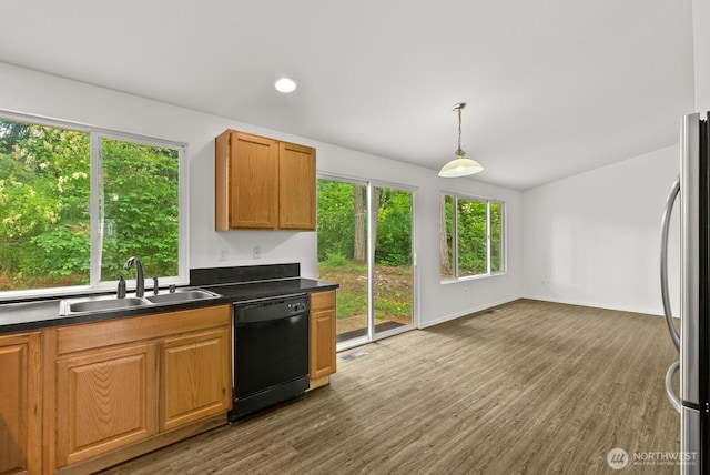 4327 Cedar Ct SE, Lacey, WA 98503 - kitchen featuring dishwasher, freestanding refrigerator, dark countertops, healthy amount of natural light, and recessed lighting