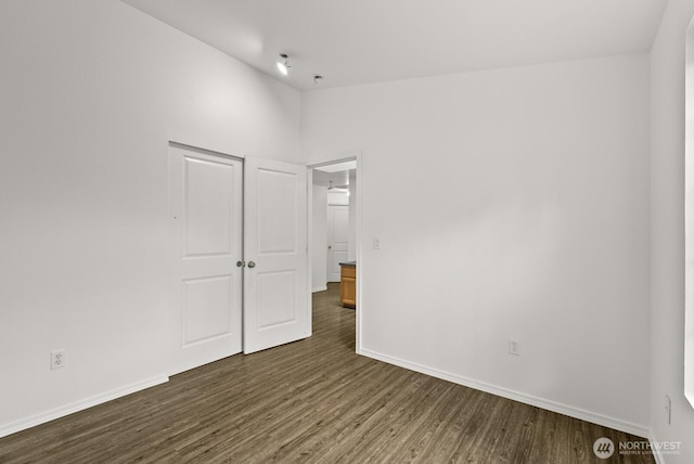 4327 Cedar Ct SE, Lacey, WA 98503 - unfurnished bedroom with dark wood-style flooring and baseboards