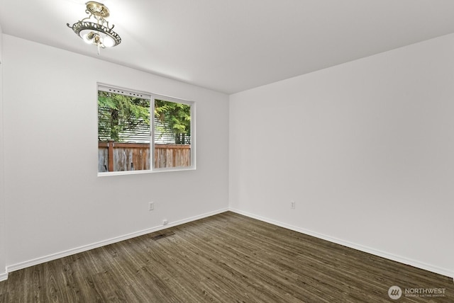 4327 Cedar Ct SE, Lacey, WA 98503 - unfurnished room with dark wood-type flooring and baseboards