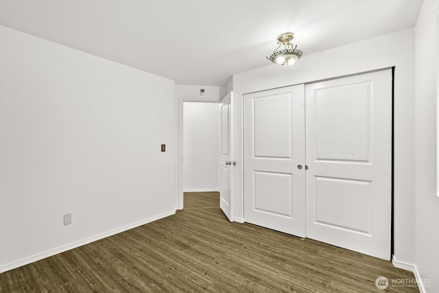 4327 Cedar Ct SE, Lacey, WA 98503 - unfurnished bedroom featuring dark wood-style flooring and a closet