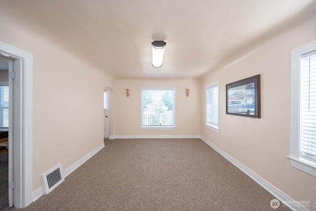 225 Basin St SW, Ephrata, WA 98823 - carpeted empty room with baseboards and arched walkways