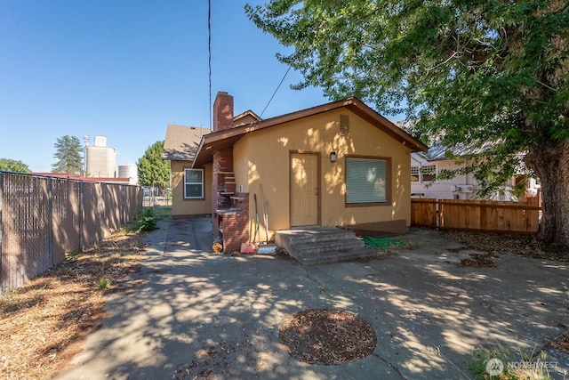 225 Basin St SW, Ephrata, WA 98823 - view of front of house with a chimney and stucco siding