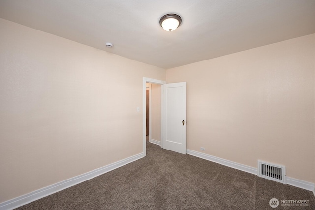 225 Basin St SW, Ephrata, WA 98823 - empty room with dark colored carpet and a smoke detector