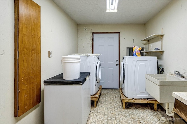 161 Lupine Dr, Sequim, WA 98382 - laundry area with washing machine and clothes dryer, light floors, and a textured ceiling