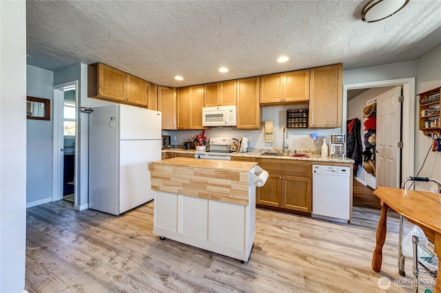 161 Lupine Dr, Sequim, WA 98382 - kitchen featuring white appliances, light wood-style floors, a textured ceiling, recessed lighting, and a kitchen island