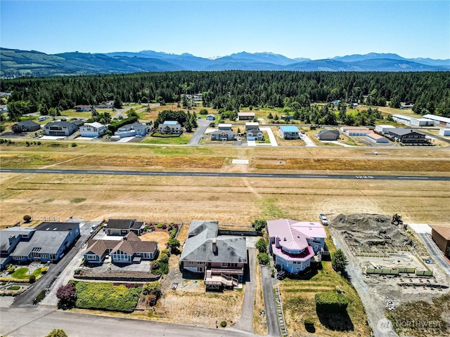 161 Lupine Dr, Sequim, WA 98382 - aerial perspective of suburban area featuring a forest and a mountainous background