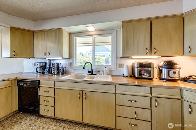 161 Lupine Dr, Sequim, WA 98382 - kitchen with black dishwasher and light brown cabinetry