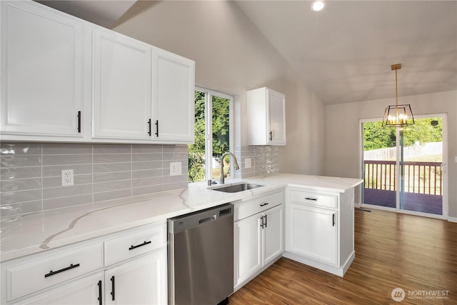 5814 Braywood Ln SE, Olympia, WA 98513 - kitchen with dishwasher, vaulted ceiling, backsplash, wood finished floors, and white cabinetry