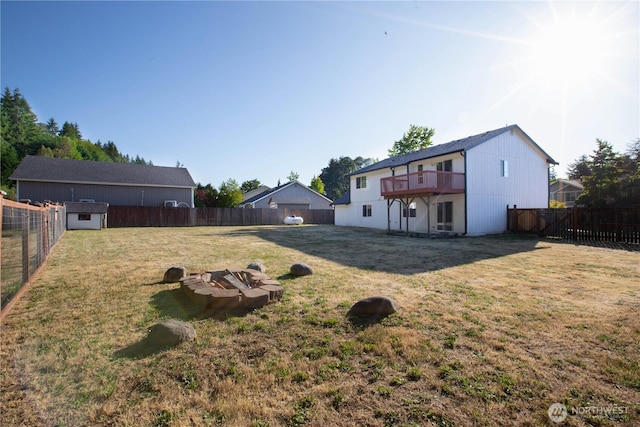 5814 Braywood Ln SE, Olympia, WA 98513 - fenced backyard featuring an outdoor fire pit