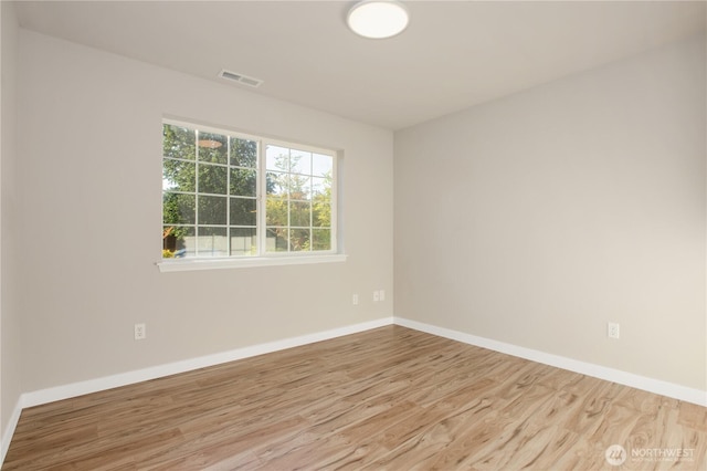 5814 Braywood Ln SE, Olympia, WA 98513 - spare room featuring wood finished floors and baseboards