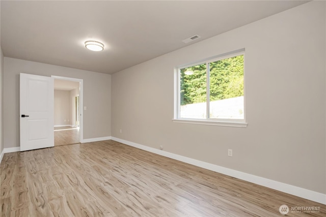 5814 Braywood Ln SE, Olympia, WA 98513 - spare room featuring light wood-style floors and baseboards