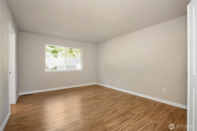 5814 Braywood Ln SE, Olympia, WA 98513 - empty room featuring wood finished floors and baseboards