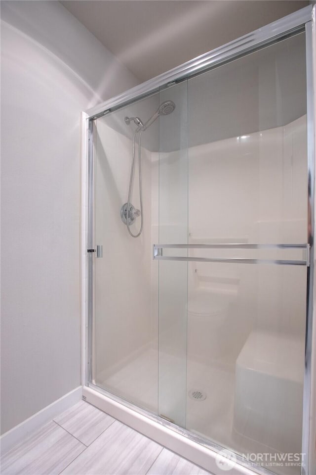 5814 Braywood Ln SE, Olympia, WA 98513 - bathroom featuring a stall shower and wood finished floors