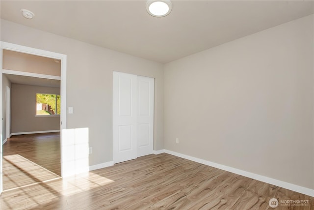 5814 Braywood Ln SE, Olympia, WA 98513 - unfurnished bedroom featuring wood finished floors and a closet