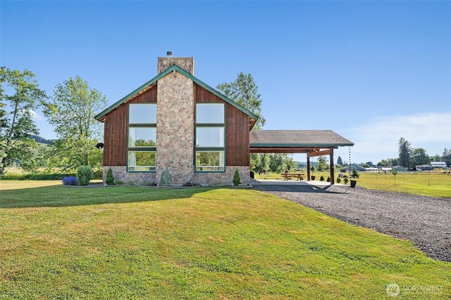3146 State Route 508, Onalaska, WA 98570 - view of front of house with a chimney, a front yard, driveway, and an attached carport
