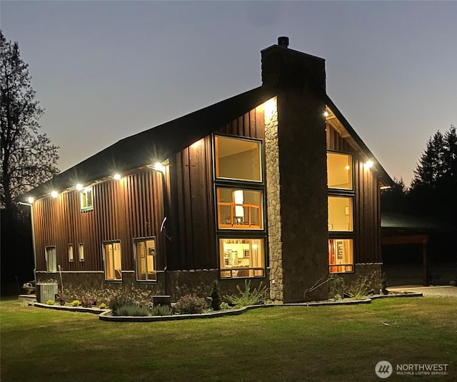 3146 State Route 508, Onalaska, WA 98570 - rear view of property featuring board and batten siding, a yard, and a chimney