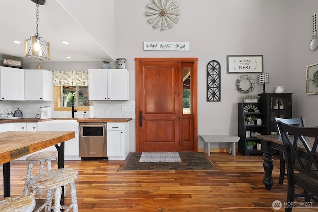 3146 State Route 508, Onalaska, WA 98570 - kitchen with wooden counters, light wood-style flooring, backsplash, white cabinets, and recessed lighting