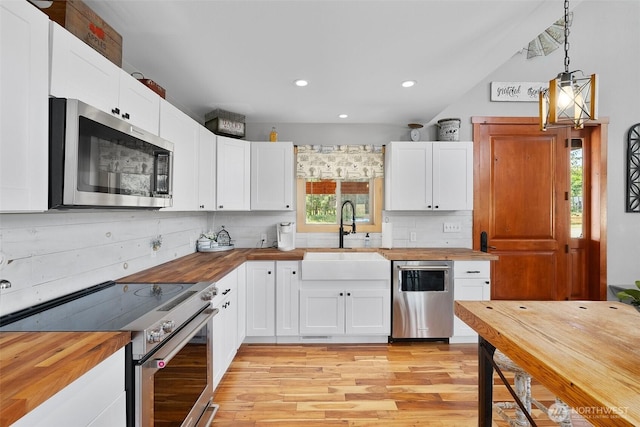 3146 State Route 508, Onalaska, WA 98570 - kitchen with butcher block counters, appliances with stainless steel finishes, plenty of natural light, and recessed lighting