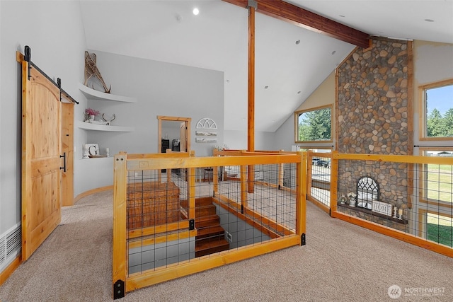 3146 State Route 508, Onalaska, WA 98570 - stairs with carpet flooring, beamed ceiling, high vaulted ceiling, healthy amount of natural light, and a barn door
