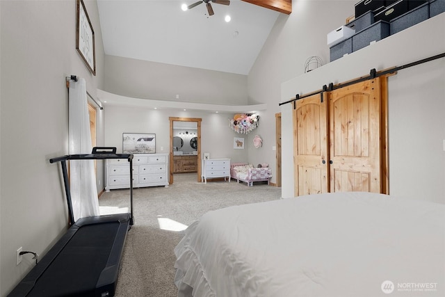 3146 State Route 508, Onalaska, WA 98570 - bedroom with a barn door, high vaulted ceiling, carpet flooring, and beam ceiling