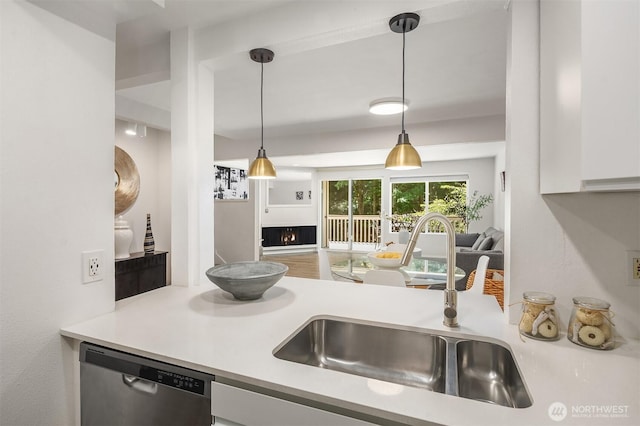 16932 NE 2nd Pl, Bellevue, WA 98008 - kitchen with dishwasher, a lit fireplace, white cabinetry, and light countertops