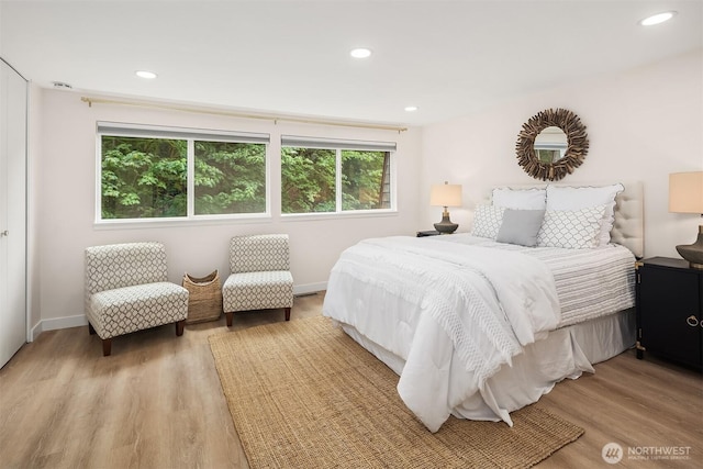 16932 NE 2nd Pl, Bellevue, WA 98008 - bedroom with light wood-style flooring and recessed lighting